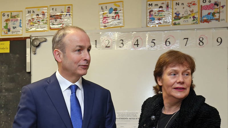 Fianna Fail leader Micheal Martin, casts his vote during the 2016 General Election with wife Mary at St&nbsp;Anthony's Boys Primary School in Ballinlough, Cork. Picture by&nbsp;Chris Radburn, Press Association