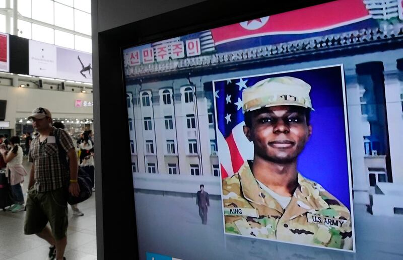 A TV screen shows a file image of American soldier Travis King during a news programme at Seoul railway station in South Korea