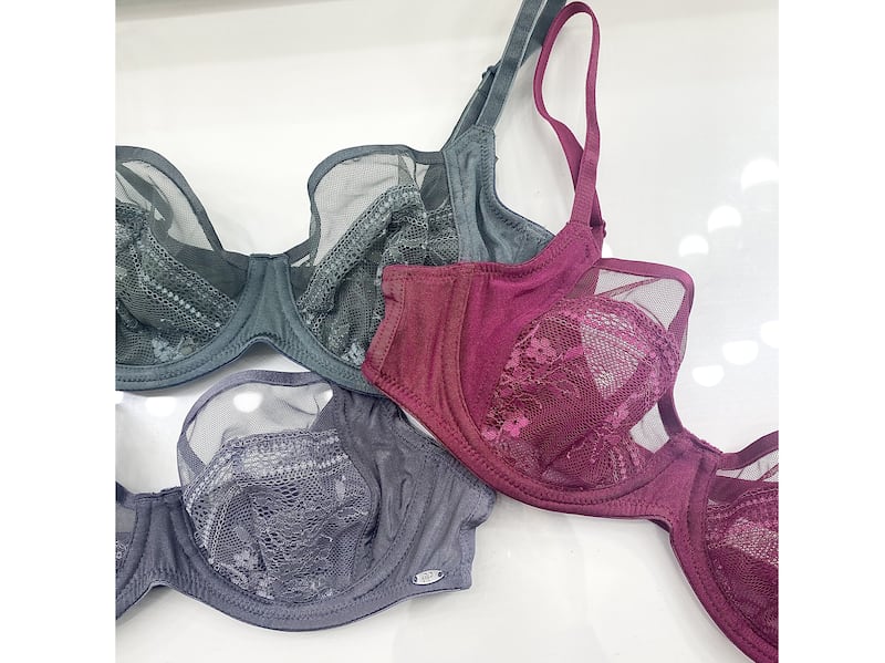 Three lacy bras in different shades