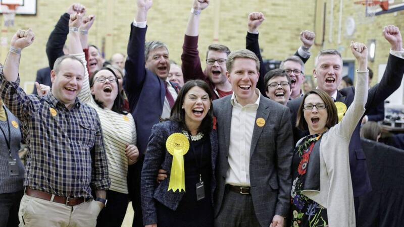 Liberal Democrat candidate Sarah Olney with her husband Ben and party supporters celebrate after winning the Richmond Park by-election, at Richmond upon Thames College in Richmond, London. Picture by Yui Mok, Press Association
