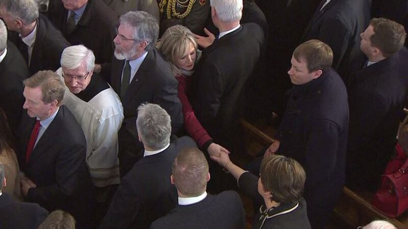 Sinn F&eacute;in's northern leader Michelle O'Neill shakes hands with DUP leader Arlene Foster