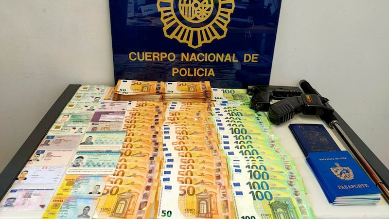 Money, weapons and documents seized in a raid (Serbian Ministry of Interior/AP)