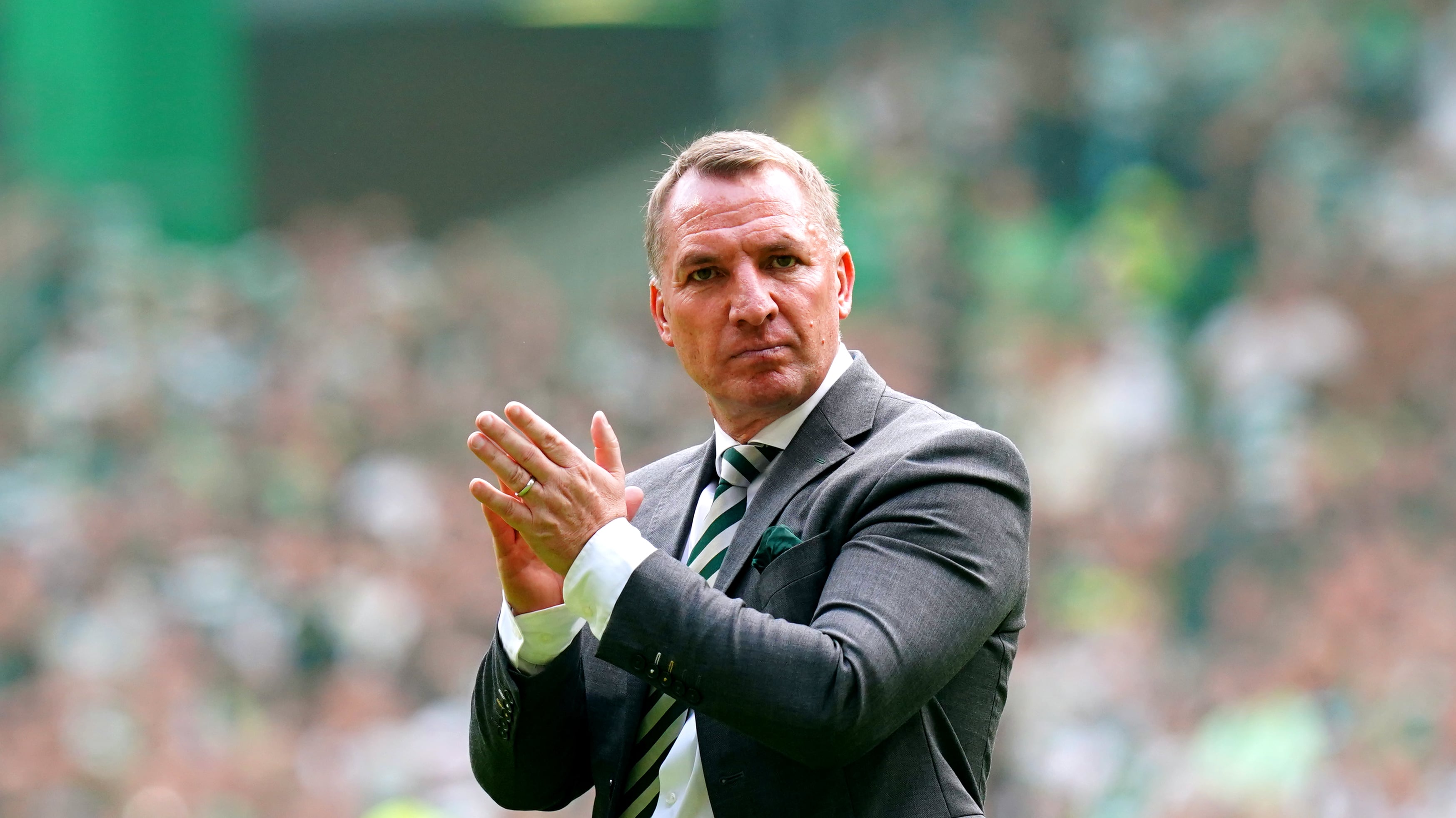 Celtic manager Brendan Rodgers applauds the fans after victory over Rangers