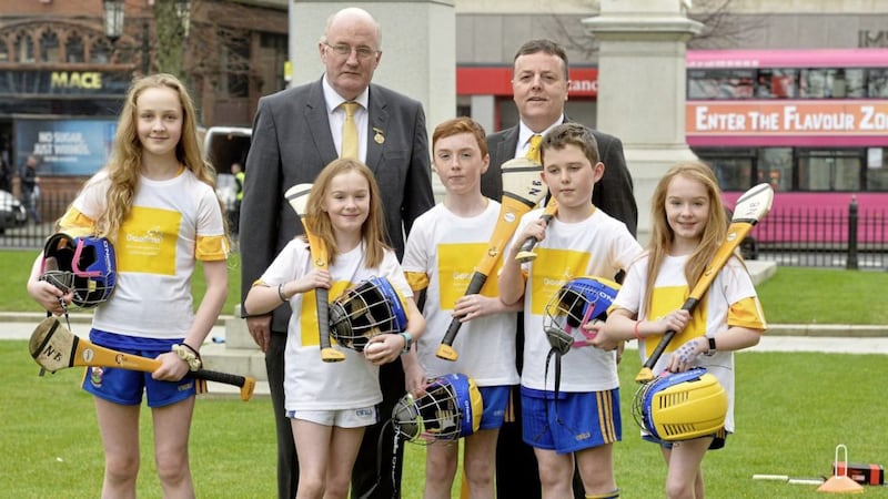 GAA President John Horan and Antrim chairman Collie Donnelly with the pupils of St Bride&#39;s at last week&#39;s &#39;Gaelfast&#39; launch at Belfast City Hall 