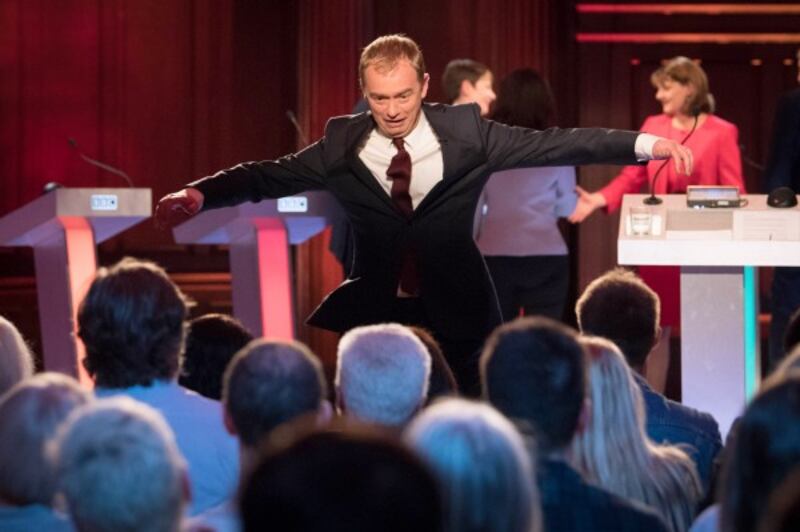 Liberal Democrats leader Tim Farron leaps off the stage 