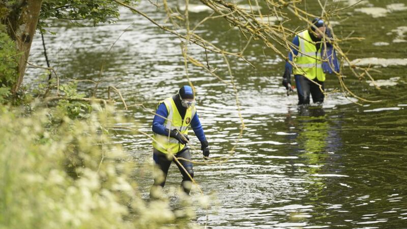 Volunteers search the River Braid in Ballymena on Sunday. Picture by Mark Marlow