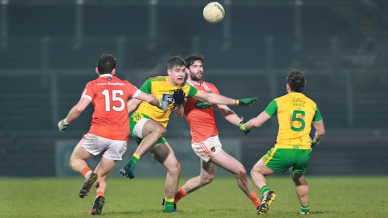 Donegal&rsquo;s Caolain McGonigle and Marty O&rsquo;Reilly (5) with Aaron Findon (8) and Oisin Mac Iomhair (15) of Armagh during Saturday night&rsquo;s semi-final at Celtic Park Picture by Margaret McLaughlin