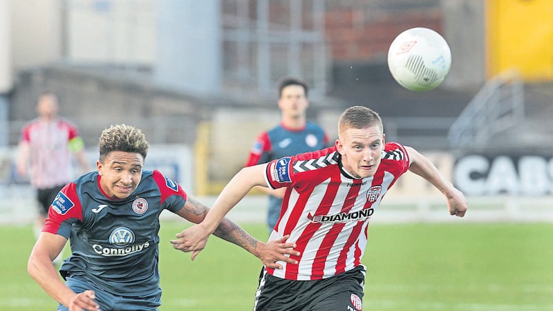 Derry City&rsquo;s Ronan Curtis with Tobi Adebayo-Rowling of Sligo Rovers<br />Picture by Margaret McLaughlin