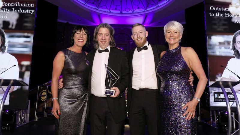 Winner of outstanding contribution to the hospitality industry Michael Deane receives his award from Gareth McColgan from NI Jobs.com. Included are Institute of Hospitality chair Marianne Hood and awards host Pamela Ballantine 