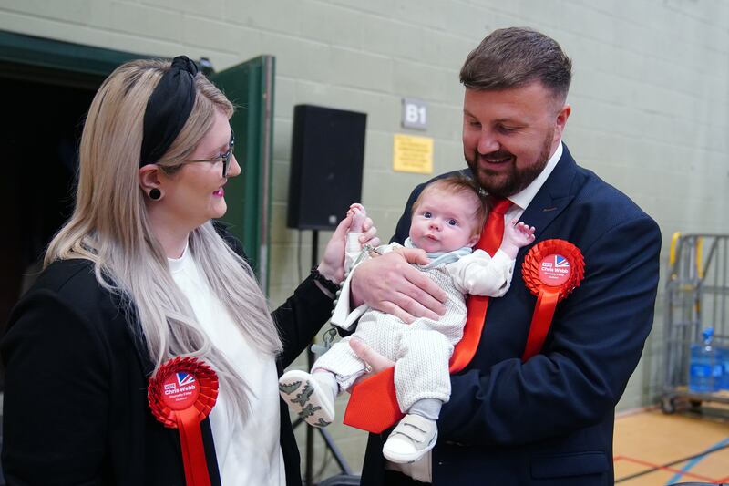 Labour candidate Chris Webb celebrates winning the Blackpool South by-election with his wife Portia and baby Cillian Douglas Webb