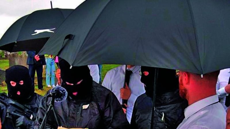 Members of &Oacute;glaigh na h&Eacute;ireann pictured in Milltown Cemetery on Easter Sunday. A masked man on the left holds a weapon belieed to have been produced using a 3D printer&nbsp;