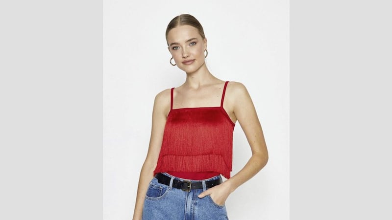 Coast Knitted Fringe Detail Top, &pound;29.40 (was &pound;49); Mid Wash Mom Jeans, &pound;35.40 (were &pound;59), available from Coast (belt, stylist&#39;s own) 