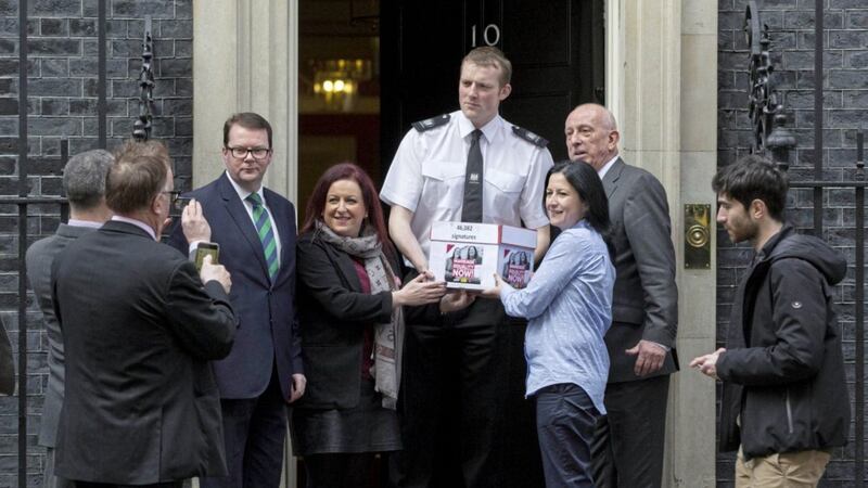 Partners Amanda McGurk, centre right, and Cara McCann, centre left, with Labour MP Conor McGinn, left, outside 10 Downing Street as they deliver their petition. Picture by Rick Findler/PA 