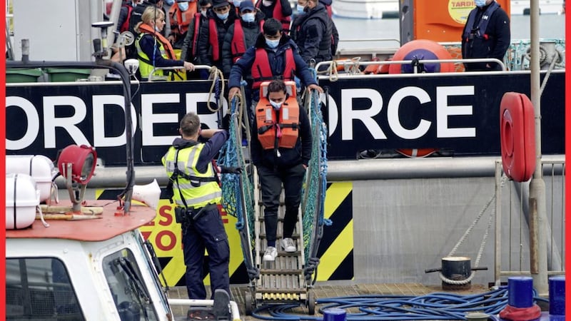 A group of people thought to be migrants are brought in to Dover, Kent, following a &#39;small boat&#39; incident in the Channel. In a heavily criticised policy, Britain intends to provide those deemed to have arrived unlawfully with a one-way ticket to Rwanda. Picture by Steve Parsons/PA Wire. 