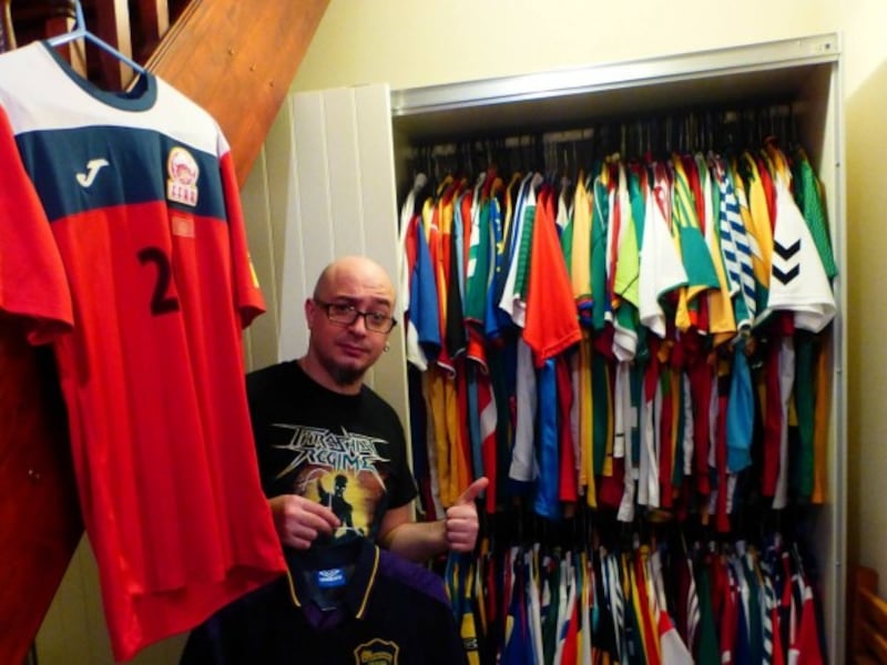 Joe Johnston with his football shirts