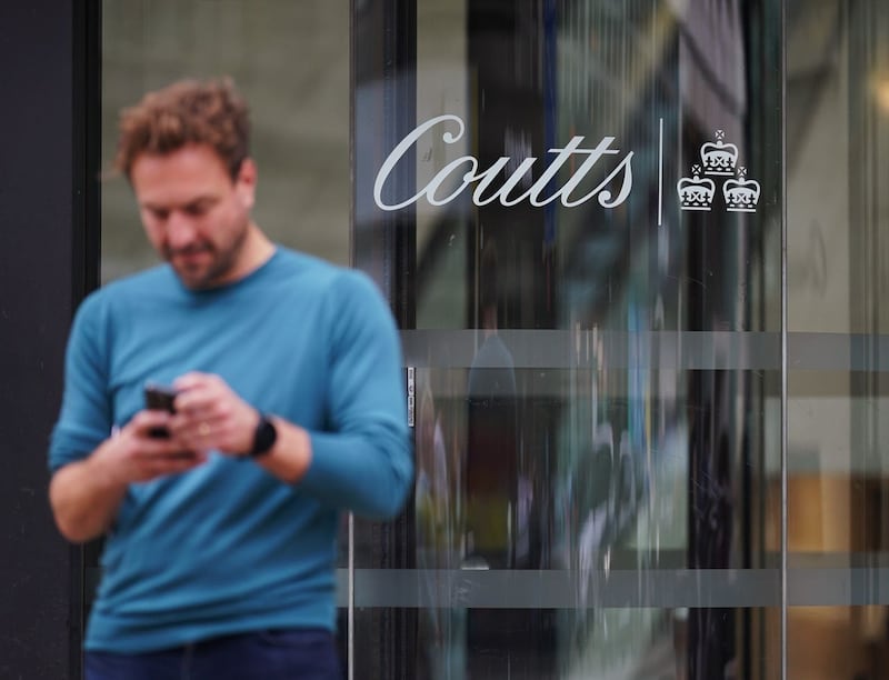 Man standing in front of a Coutts building