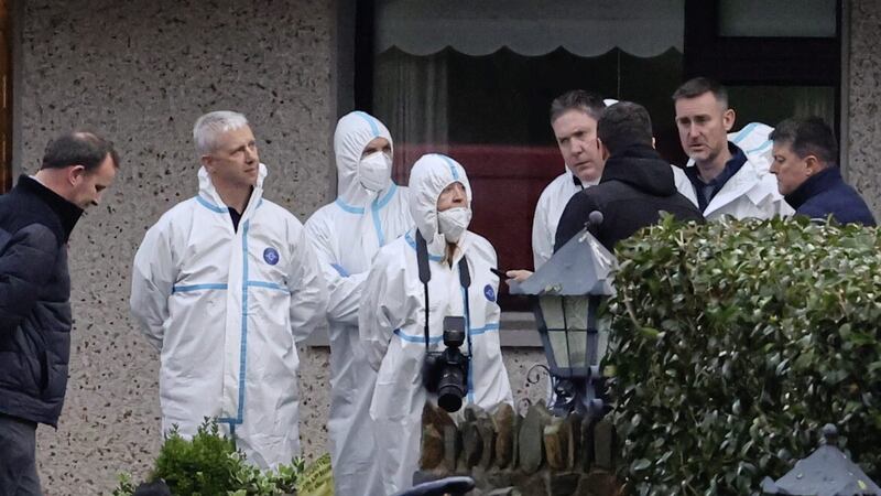 Forensic officers and gardai at a house in Castleblayney Co Monaghan, where the body of a man was discovered 