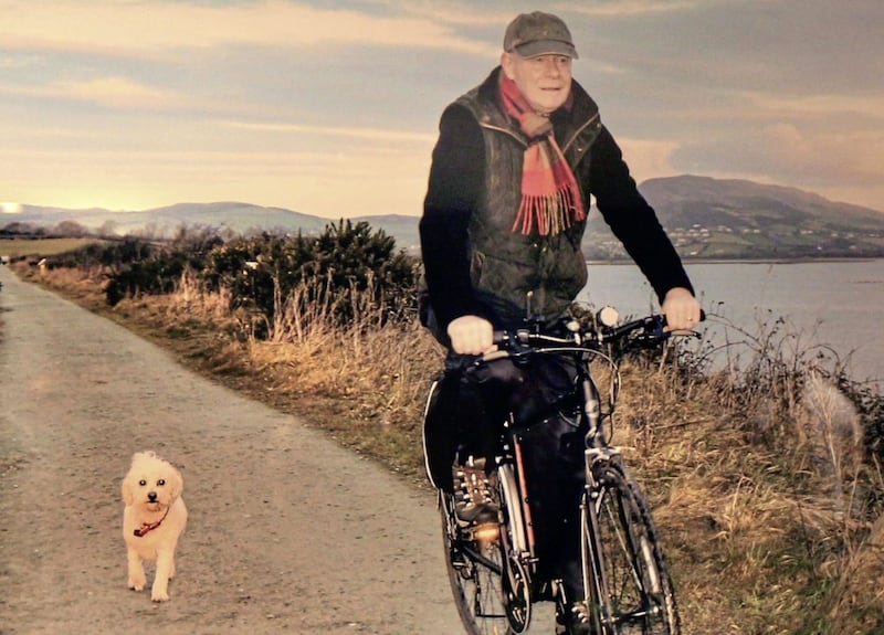Martin McGuinness on the bike in Donegal with his puppy Buttons. Images on display at the Gasyard centre in Derry&#39;s Bogside. The photographic exhibition, curated by the McGuinness Family chronicles his life including images from the family&#39;s private collection. Picture copy Margaret McLaughlin 9-8-17. 