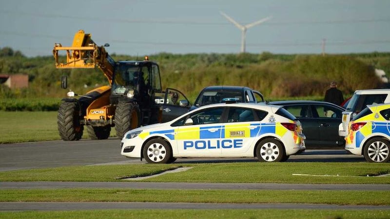 Police at the scene at Breighton airport near Selby, north Yorkshire, where five people have been seriously hurt in a helicopter crash at the aerodrome. Picture by Anna Gowthorpe, Press Association