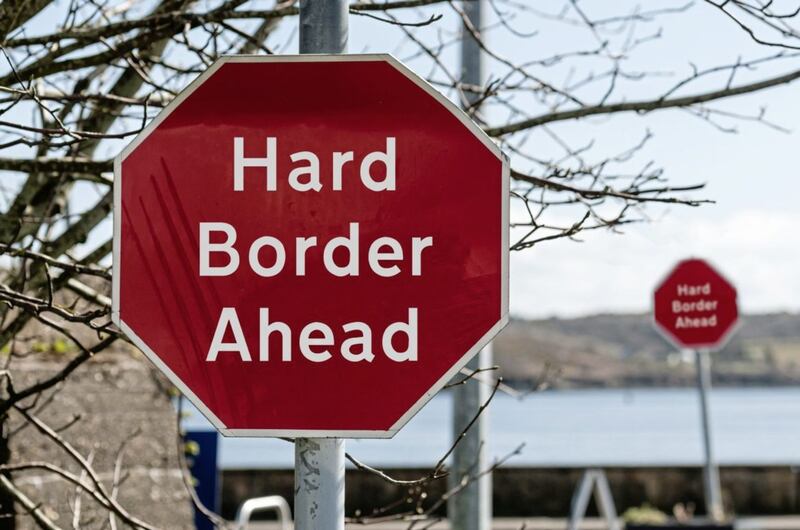 Sign at a stop junction in Ireland saying &quot;Hard Border Ahead&quot;. 