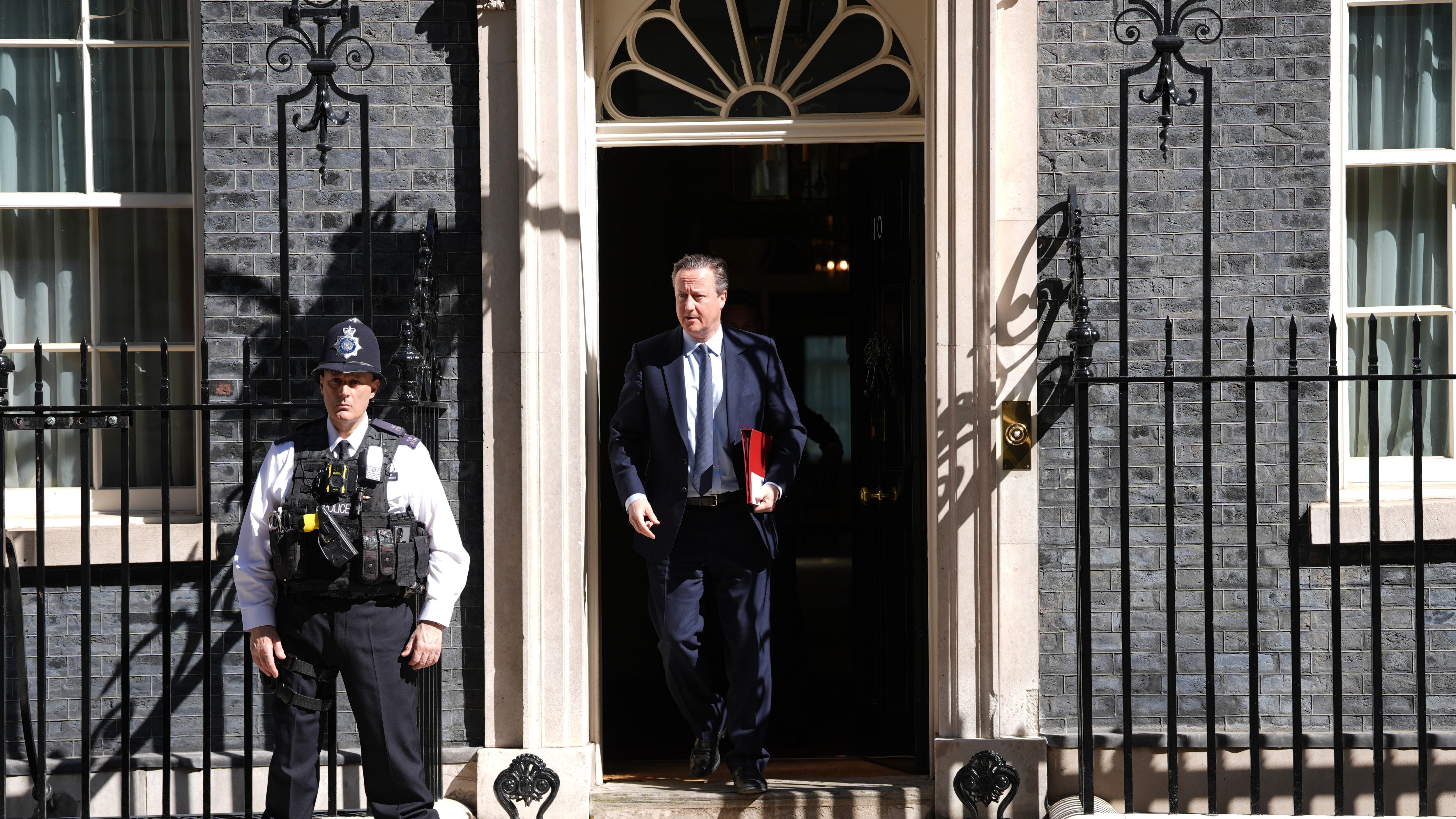 Foreign Secretary Lord David Cameron leaves Downing Street