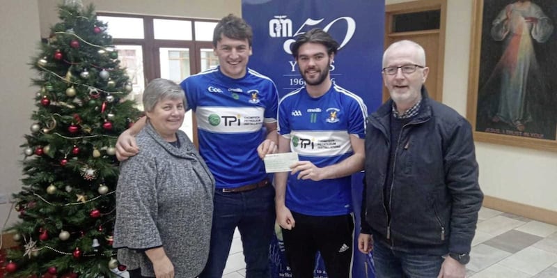 St John&rsquo;s, Belfast players Domhnall Nugent and Ross Hannigan present a cheque for &pound;1,623.50 to Sr Sheila and Gerry McElroy at Cuan Mhuire Centre, Newry. The money was raised when Ross was sponsored to have his long hair cut in support of Domhnall and the centre 