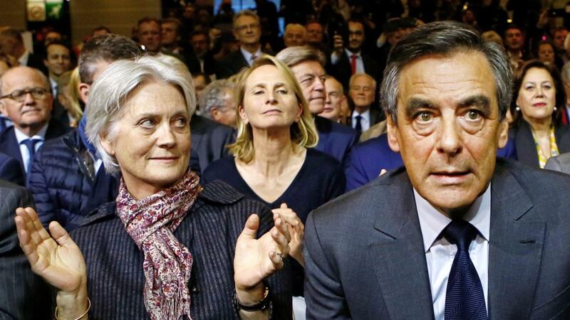 Francois Fillon, the conservative candidate for the French presidential election, sits with his wife Penelope, left, during a rally in Paris last year 