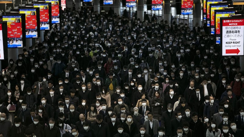 A crowd of commuters at Shinagawa Station in Tokyo last year during the first wave of Covid-19 (AP Photo/Jae C Hong)&nbsp;