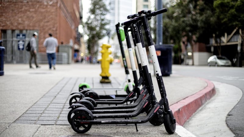 Electric scooters in a city available for rent. 
