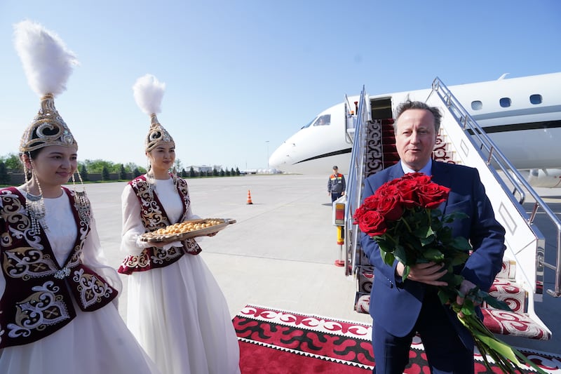 Foreign Secretary Lord David Cameron arrives at Bishek airport in Kyrgyzstan