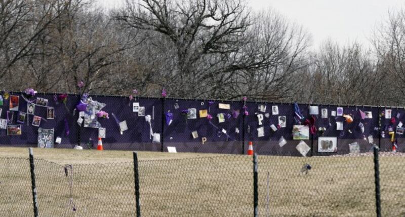 Fan tributes left at the memorial fence in Prince's Paisley Park.