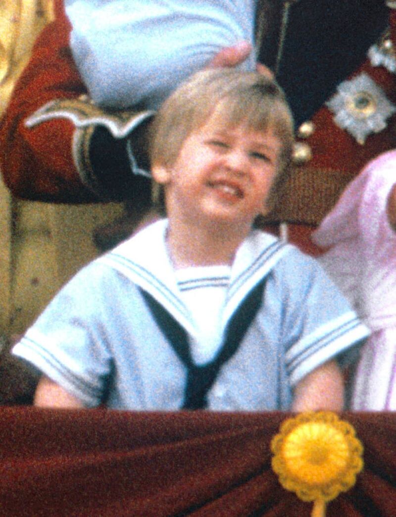 Prince William, now the Duke of Cambridge, on the balcony of Buckingham Palace, London, to watch the fly past, following Trooping the Colour. Prince Louis is today wearing a similar outfit to his father’s from 1985