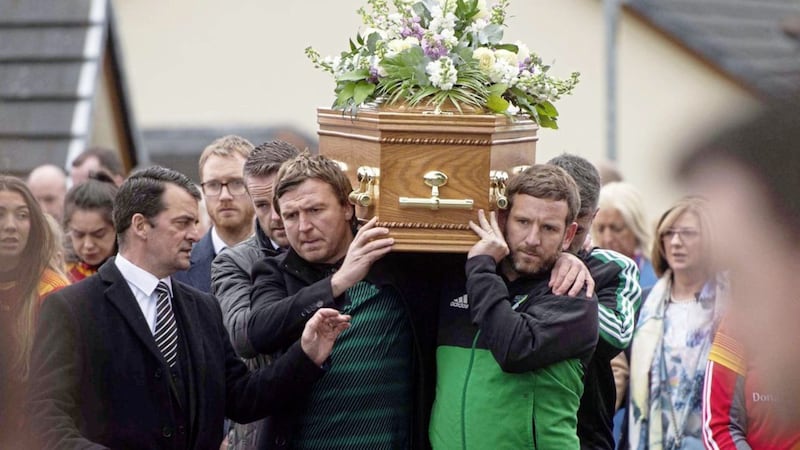Former Tyrone player Owen Mulligan (left) was among mourners at the funeral of Siobhan McCann. Picture by Mark Marlow 