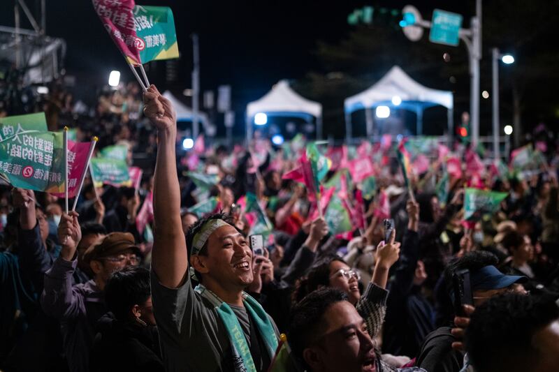 The crowd cheers at a Democratic Progressive Party rally in New Taipei City, Taiwan where frontrunner Lai Ching-te emerged victorious (AP Photo/Louise Delmotte)
