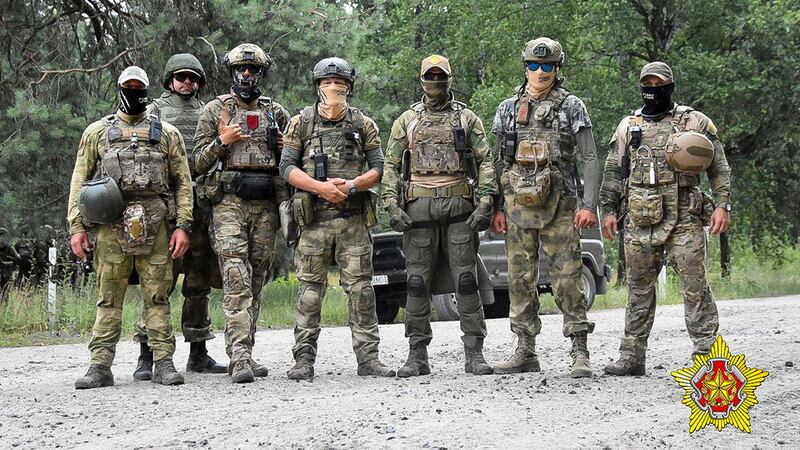 Belarusian soldiers of the Special Operations Forces (SOF) and mercenary fighters from Wagner private military company pose for a photo near the border city of Brest, Belarus (Belarus Defence Ministry via AP/PA)