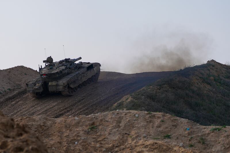 An Israeli tank in a position on the border with the Gaza Strip, as seen in southern Israel (Tsafrir Abayov/AP)