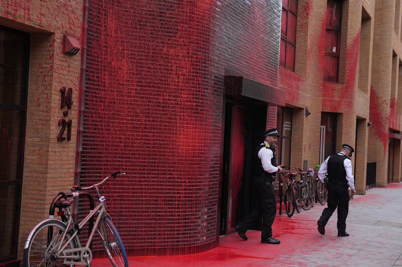 Police outside the Labour Party headquarters in London after red paint was thrown over the outside of the building