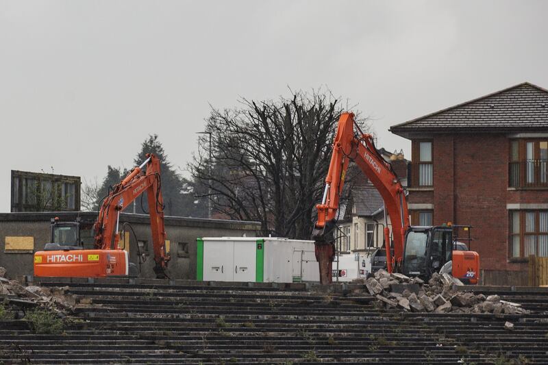 Contractors with excavators have begun clearing the concrete terraces at the ground in Belfast