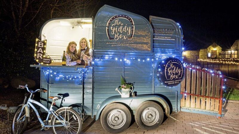 Sister Karan McLernon and Siobhan Reilly ready to serve drinks within the converted horse trailer &#39;The Giddy Box&#39; 