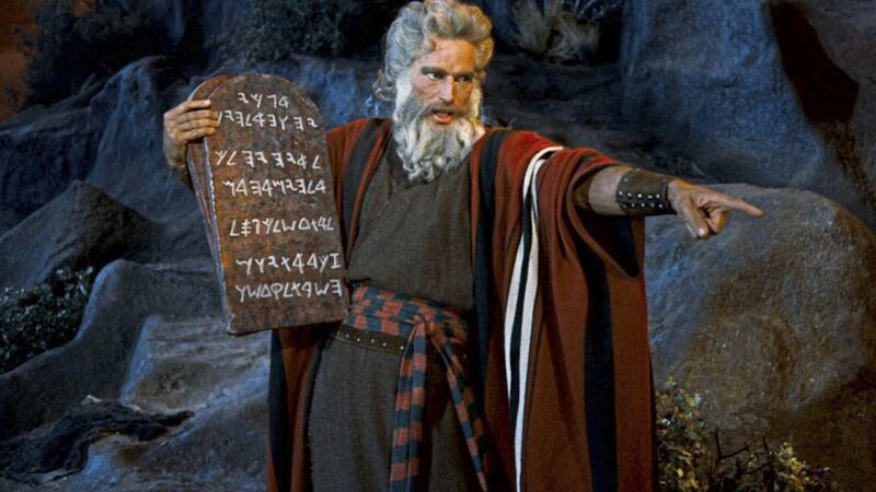 Moses, as depicted by Charlton Heston in the 1956 epic The Ten Commandments, shows God&#39;s law to the people. Jesus explained that love must come before law 