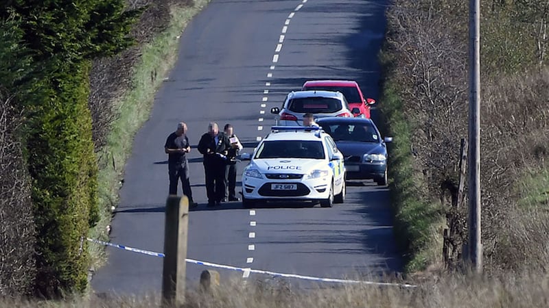Police at the scene of the crash on the Glenside Road in Dunmurry&nbsp;