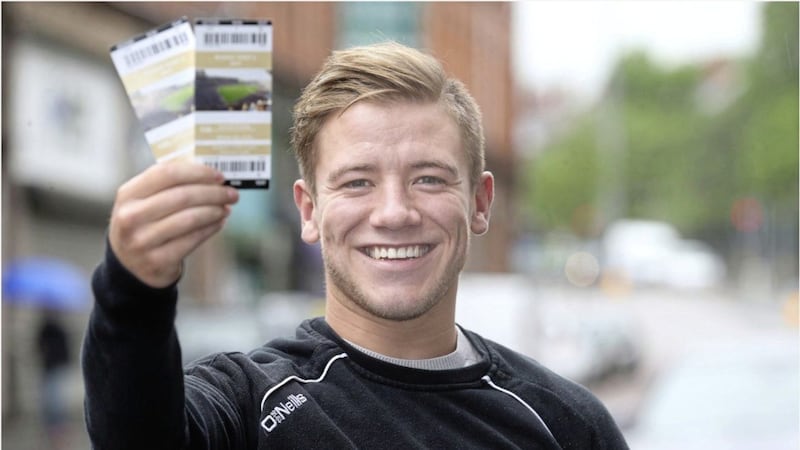 Tyrone forward Mark Bradley holds two precious tickets for the All-Ireland semi-final, which are going to lucky Irish News reader Denis Donaghy of Galbally. Picture by Hugh Russell 