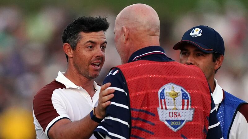 Rory McIlroy argues with Joe LaCava (Mike Egerton/PA)