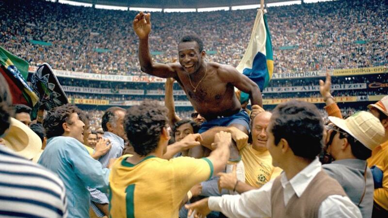 Brazil's star Pele being hoisted on shoulders of his team-mates after Brazil won the ninth World Cup final against Italy 4-1 in Mexico City's Estadio Azteca Mexico on June 21 1970. Pele, who scored the opening goal of the game and assisted two, won his third winner's medal. The World Cup victory was Brazil's third win for the Jules Rimet Cup.&nbsp;