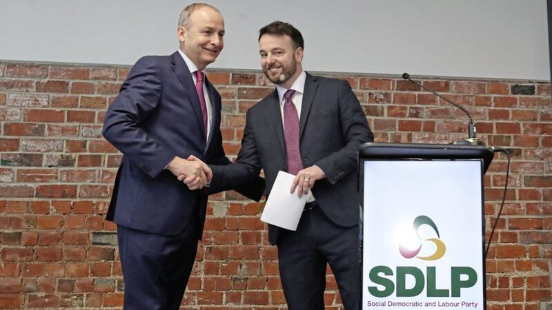 SDLP leader Colum Eastwood and Fianna F&aacute;il leader Miche&aacute;l Martin launching their parties&#39; partnership plan in Belfast last year. Picture by Niall Carson/PA 
