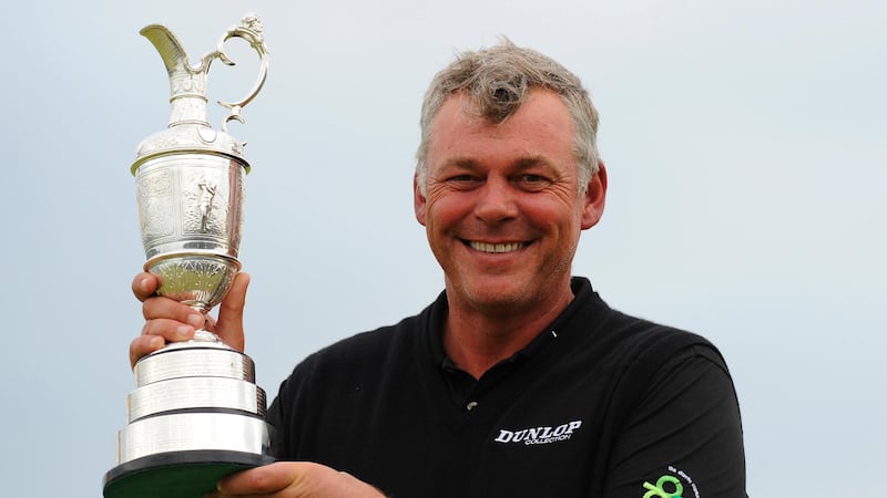 Darren Clarke holds the Claret Jug after winning the 2011 Open Championship at Royal St George’s (Owen Humphreys/PA)