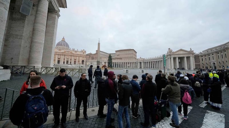 People wait in a line to enter Saint Peter’s Basilica at the Vatican where late Pope Benedict 16 is being laid in state at The Vatican, Monday, Jan. 2, 2023. Benedict XVI, the German theologian who will be remembered as the first pope in 600 years to resign, has died, the Vatican announced Saturday. He was 95. (AP Photo/Andrew Medichini)