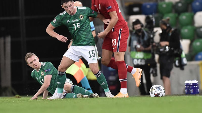 Norwegian prodigy Erling Braut Haaland towers over Northern Ireland's Jordan Thompson and the grounded Shane Ferguson.<br />Pic Colm Lenaghan/Pacemaker&nbsp;