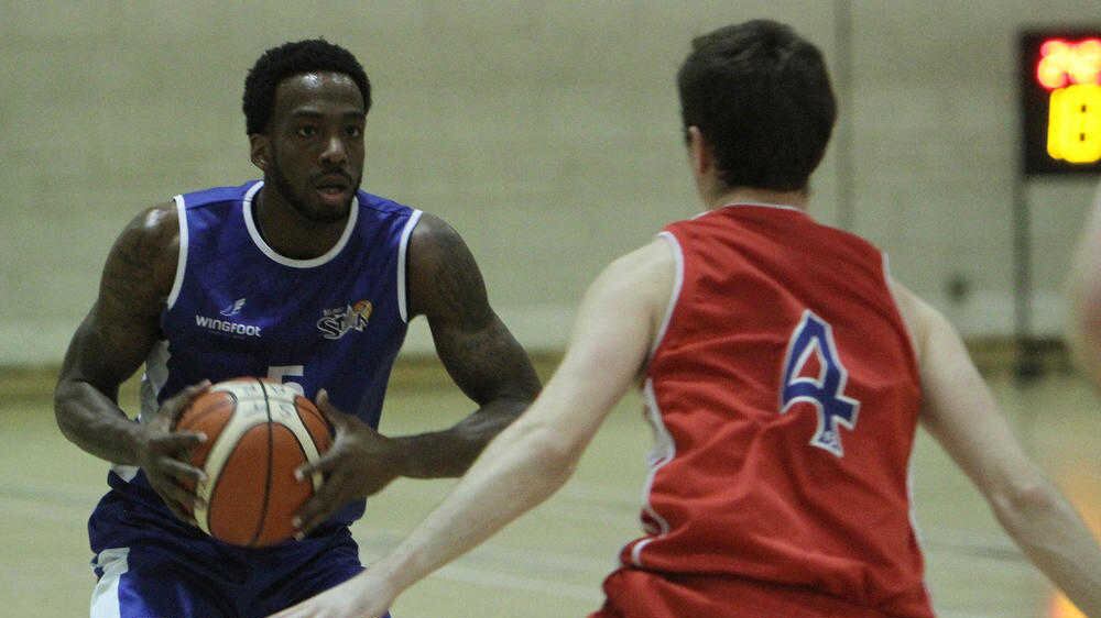Belfast Star's Shawn Vanzant up against Adrian O'Sullivan of UCC Demons at Methodist College, Belfast in the All-Ireland Basketball Premier League Picture by Colm O'Reilly