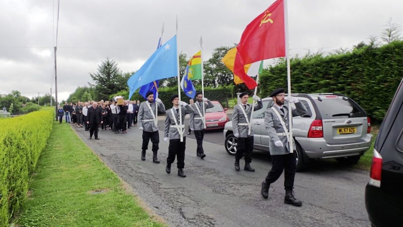 A colour party leads the funeral of Michael McManus in Co Fermanagh earlier this week  
